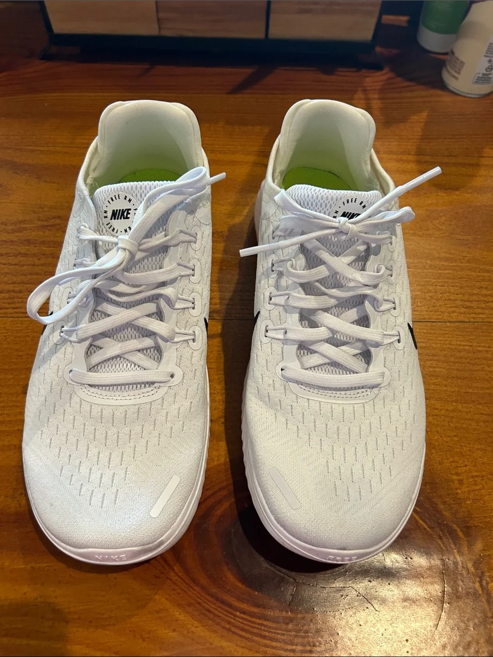 Nike Women’s White Athletic Running Shoes with Black Swoosh